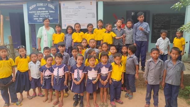 Monica Teron, teacher of Dilaram Terang LP School at Borlangpher Tiniali on NH 329, with her students.