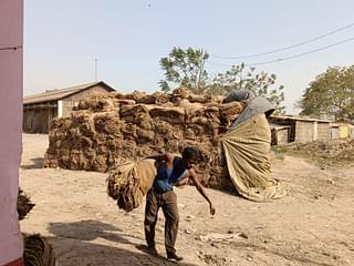 A worker collecting bags in  Gulabbagh. 