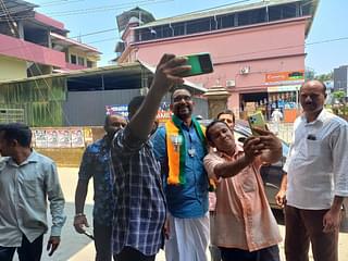 People clicking pictures with Surendran outside Leo Hospital. (Image Credit: S Rajesh)