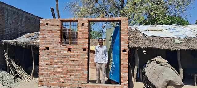 Bhaale singh at the under construction house under PMAY (G), next to his old house. 