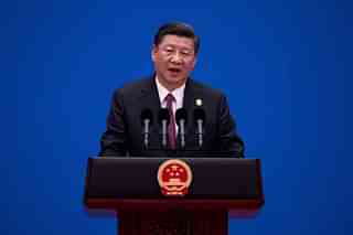 President Xi Jinping speaking at a conference in Beijing. (Photo by Nicolas Asfouri-Pool/Getty Images)