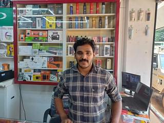 Shafi M S at his mobile shop. (Image Credit: S Rajesh)