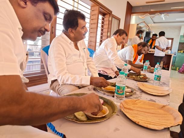Having a sumptuous meal of ragi balls, chicken curry and fish fry at a well-wisher's house.