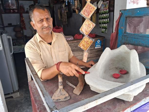 Bodh Raj Prajapati showing the older tools they have been using. (AnkitSaxena/Swarajya)