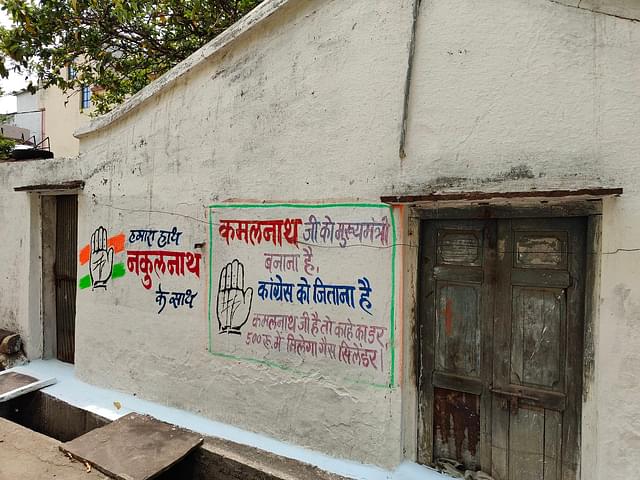 Congress campaign slogans inked on a wall in Chhindwara in 2023. 