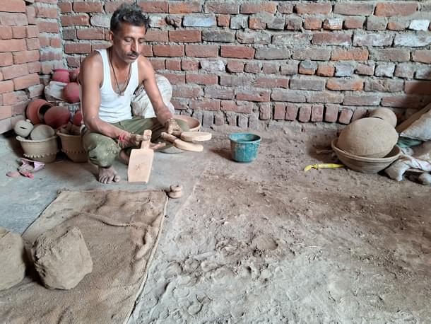 Vijay showing some of the traditional tools used in their craft. (AnkitSaxena/Swarajya)