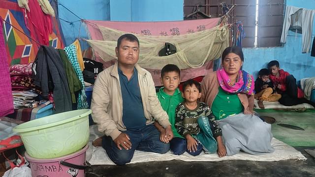 Chalamba Singh with his wife and children in the relief camp