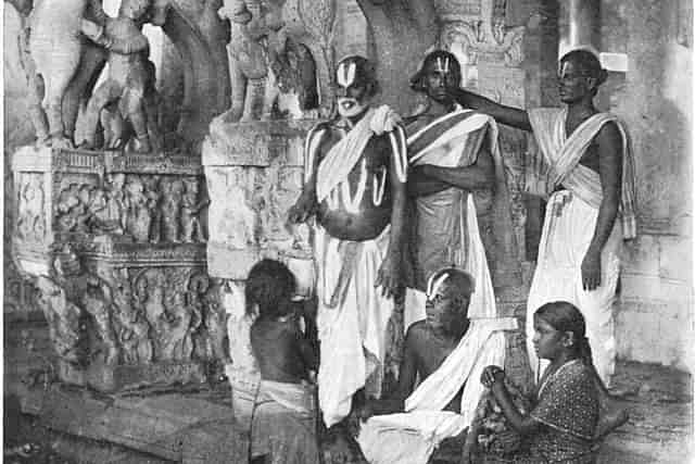 Brahmins and a devadasi. (Wikimedia Commons)