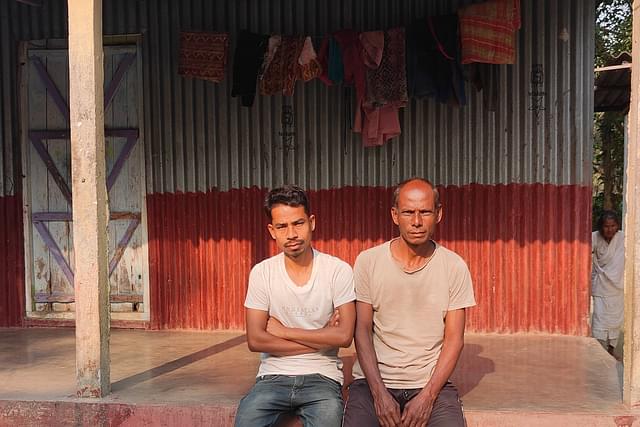 Titu Roy Sarkar (left) with his father Ajit in front of their house.