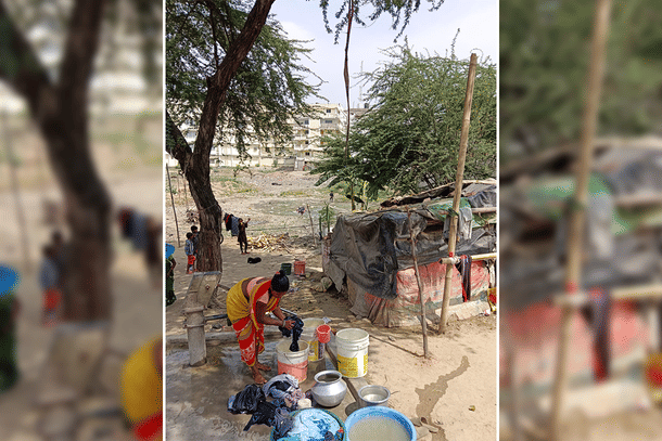 A lady using hand pump for her daily chores.