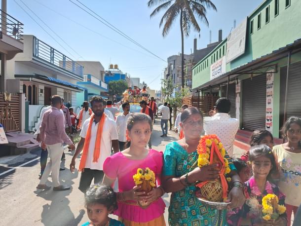 Women in the neighbourhood carry the kalasa.