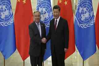 Chinese President Xi Jinping (right) shakes hands with United Nations Secretary-General Antonio Guterres