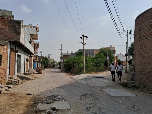 Open drains and broken roads like these can be seen everywhere.