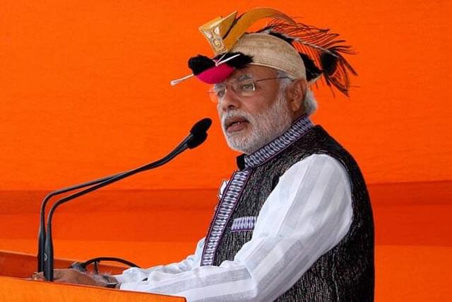 Prime Minister Modi wearing a hornbill cap during campaign in Arunachal Pradesh