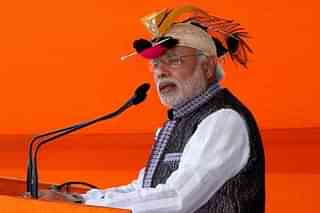 Prime Minister Modi wearing a hornbill cap during campaign in Arunachal Pradesh