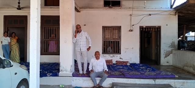 Shubhash Patel (sitting on the porch), a local from Anjlav, with his family.