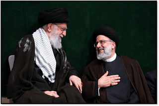 Khamenei (left) and Raisi (right)
