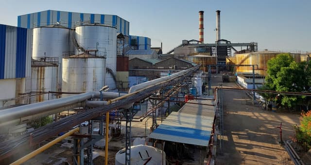 An over-view of the Malegaon Co-Operative Sugar Factory with the chimneys of the co-generation power plant visible in the background.