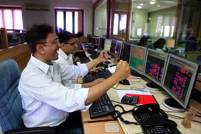 Traders rejoice as Sensex surges at Bombay Stock Exchange. (Anshuman Poyrekar/Hindustan Times via Getty Images) 