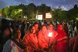 Women holding a fire torch at Swabhimaan Jyota Rally.