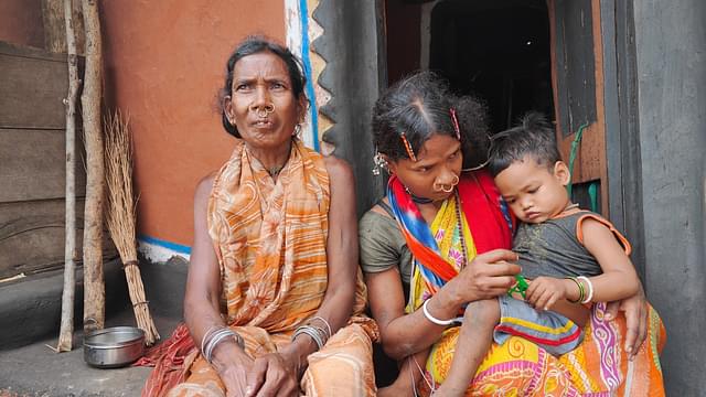 Rupul Majhi (left) with her daughter Dundi who's holding her nephew