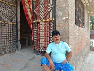 Parvez Alam resting outside his house