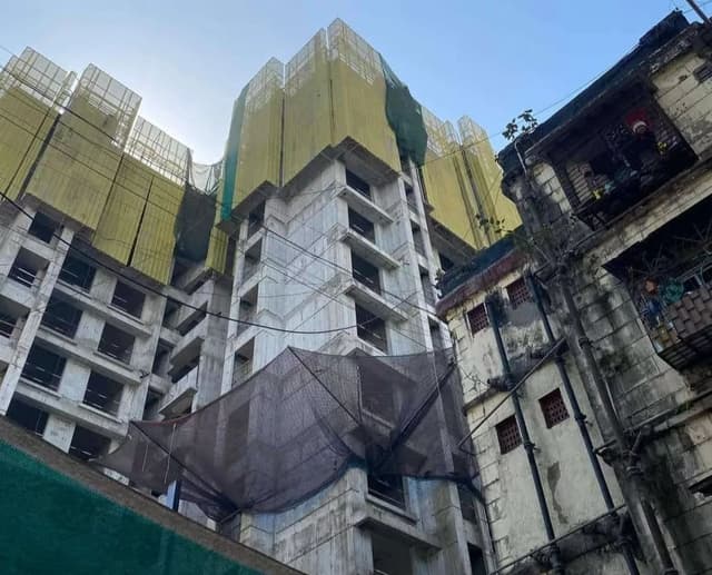 A dilapidated BDD chawl in Worli, flanked by a high-rise coming up in the place of a neighbouring chawl. Managed by the state housing agency MHADA, the BDD redevelopment project will create additional houses that can be sold after rehabilitating the original residents.