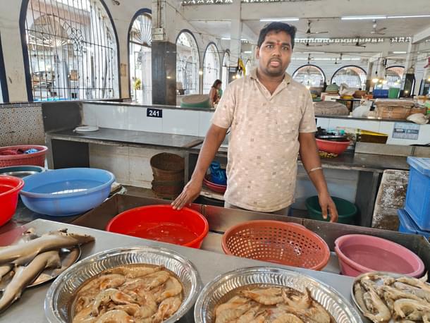 Ganesh, with the fresh produce from Benaulim poses for a photo.