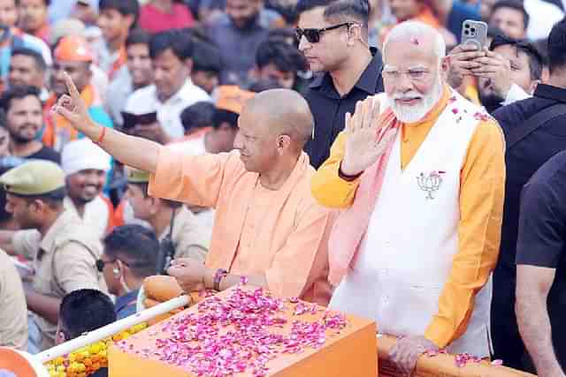 PM Narendra Modi holding roadshow with UP CM Yogi Adityanath.