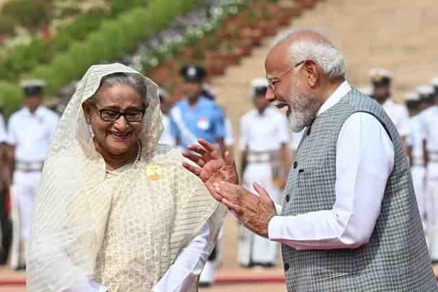 Prime Minister Narendra Modi with Sheikh Hasina in the forecourt of Rashtrapati Bhawan.