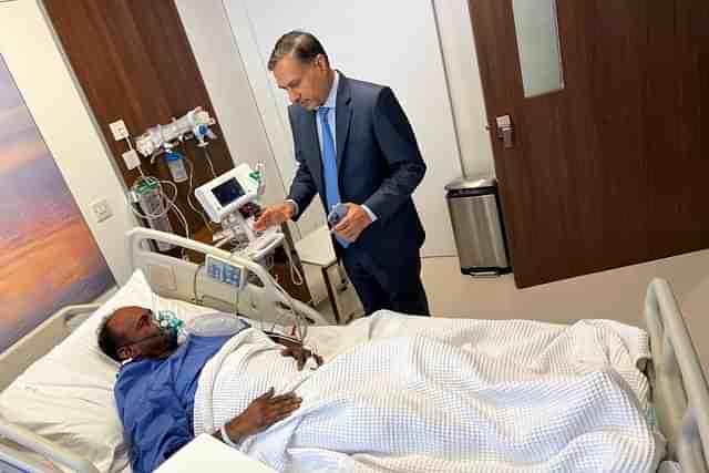 Indian envoy in Kuwait meeting one of the injured worker (Pic Via Twitter)