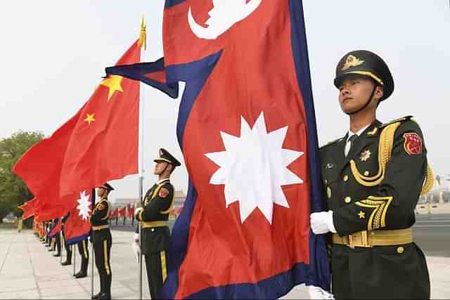 Nepalese and Chinese flags at the Great Hall of the People in Beijing. 