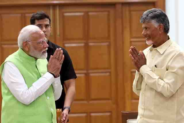 PM Narendra Modi and Chandrababu Naidu greeting each other in NDA meeting