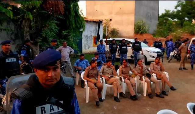 A team of police in the colony after the video went viral