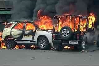 Vehicles set ablaze in Manipur.