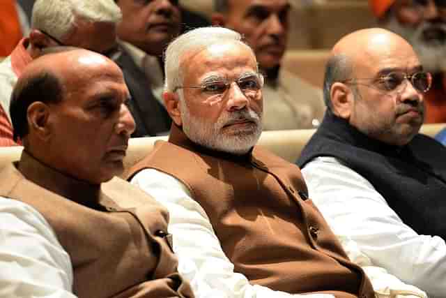 PM Modi (centre), Rajnath Singh (left) and Amit Shah. (PRAKASH SINGH/AFP/Getty Images)