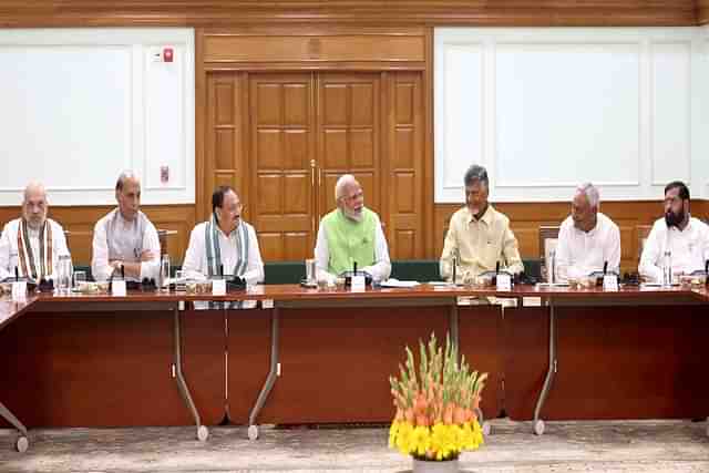 Prime Minister Narendra Modi along with the other NDA leaders during a meeting in New Delhi on Wednesday (5 June 2024).