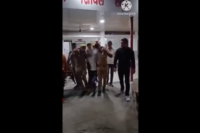 Still from a video showing Qureshi after his arrest, limping