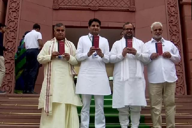 Opposition leaders holding Constitution copies outside parliament