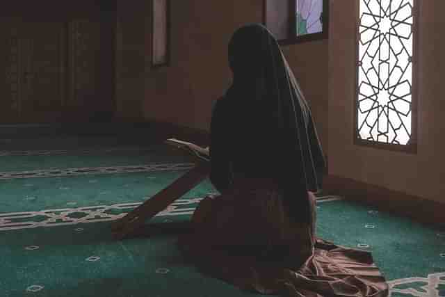 Girl offering namaz