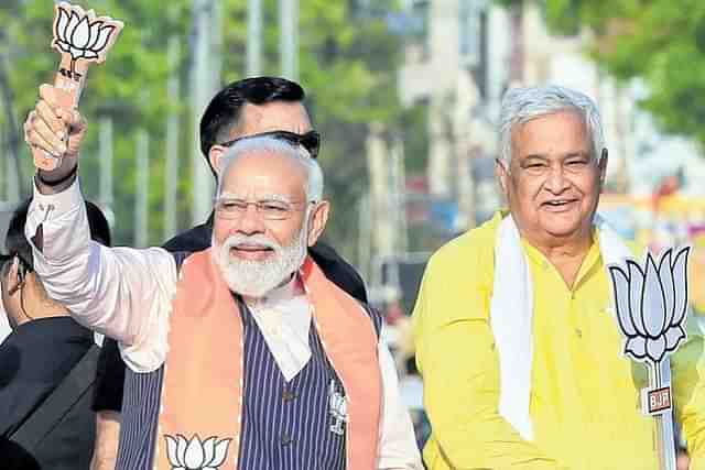 Kirodi Lal Meena (R) with Prime Minister Narendra Modi (L)