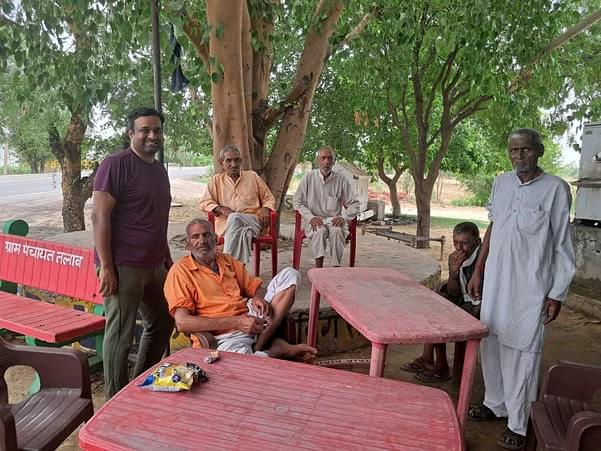 Banuchandar Nagarajan with a group of farmers at a local tea stall