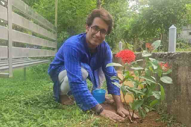 Pradeep Bhandari planting a sapling