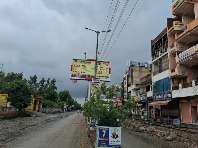 Half of a road remains under mud and garbage for days, as the water drains out gradually