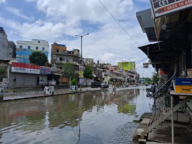Students struggle, jump over open drains, along electric poles to reach institutes. 