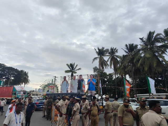 Police personnel gear up for the visit, as cutouts of Congress leaders welcome the crowd. 