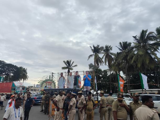 Police personnel gear up for the visit, as cutouts of Congress leaders welcome the crowd.