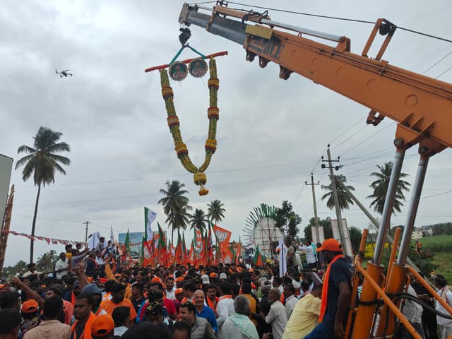 A drone captures the visuals, as a crane welcomes the crowd with a garland made of sweet lime.
