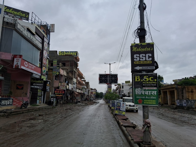 The front facades are lined with institutes, cafeterias, and shops, while the back streets are packed with hostels and PGs