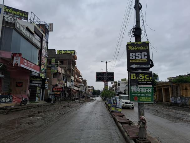 The front facades are lined with institutes, cafeterias, and shops, while the back streets are packed with hostels and PGs